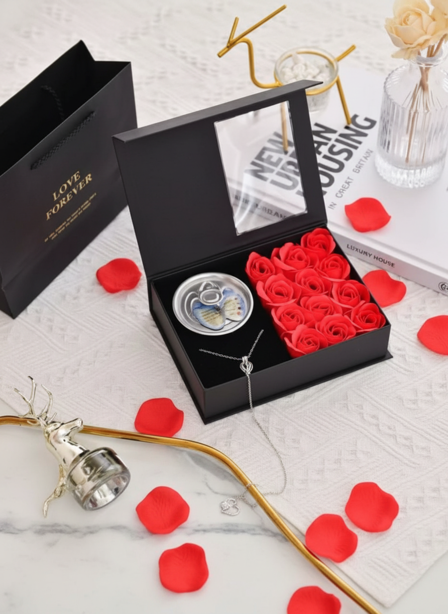 Pearl necklace with a box of roses.
