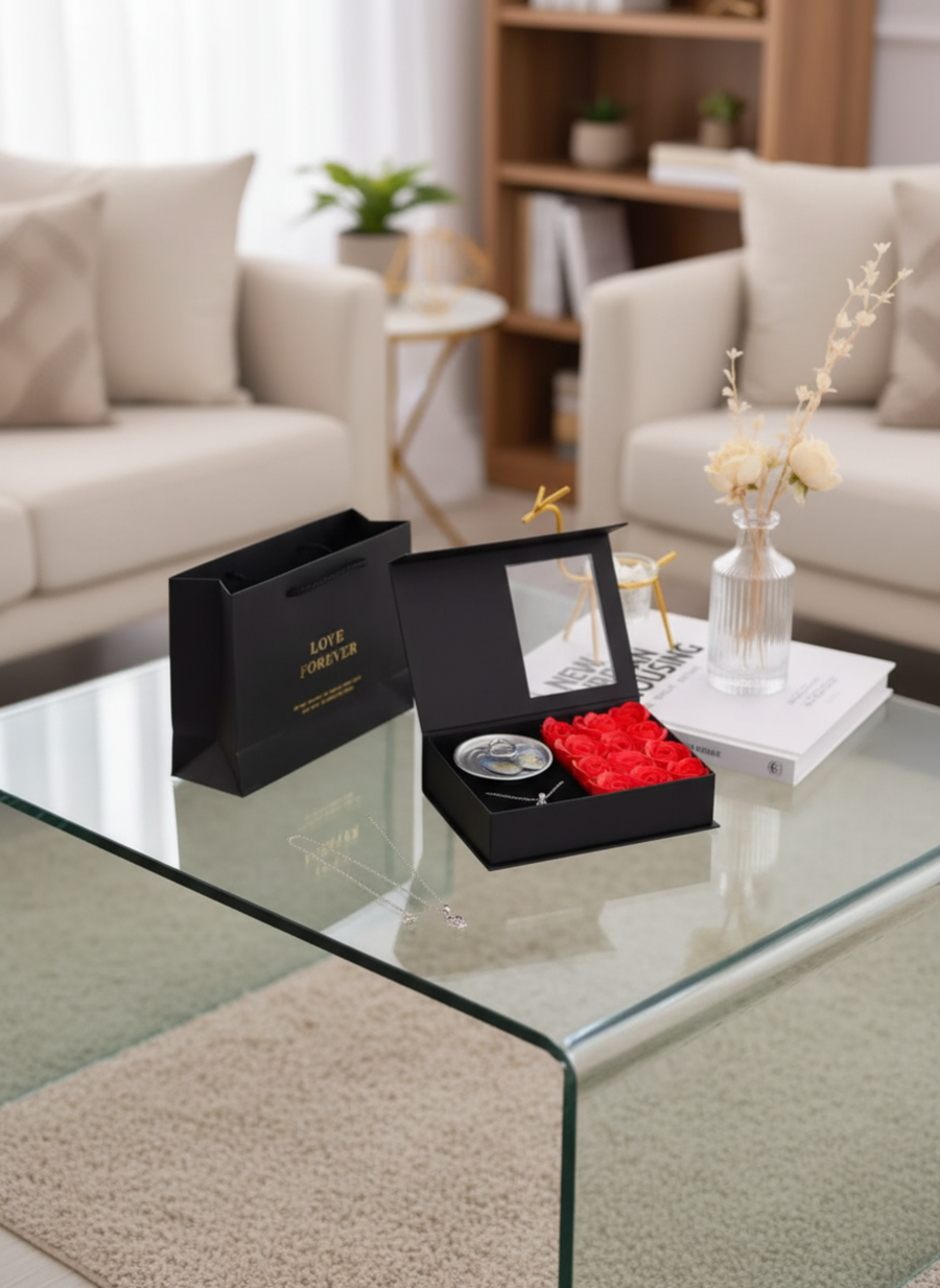 Pearl necklace with a box of roses.