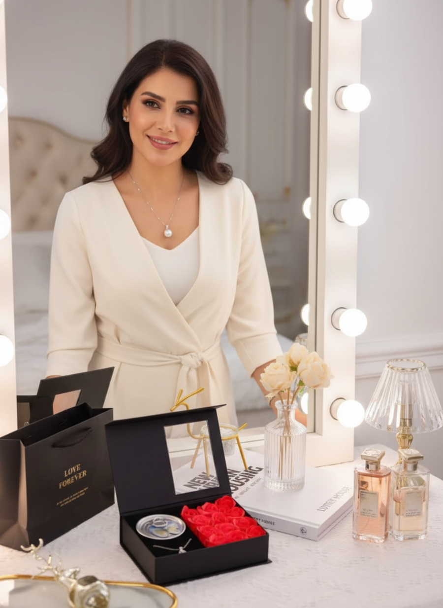 Pearl necklace with a box of roses.