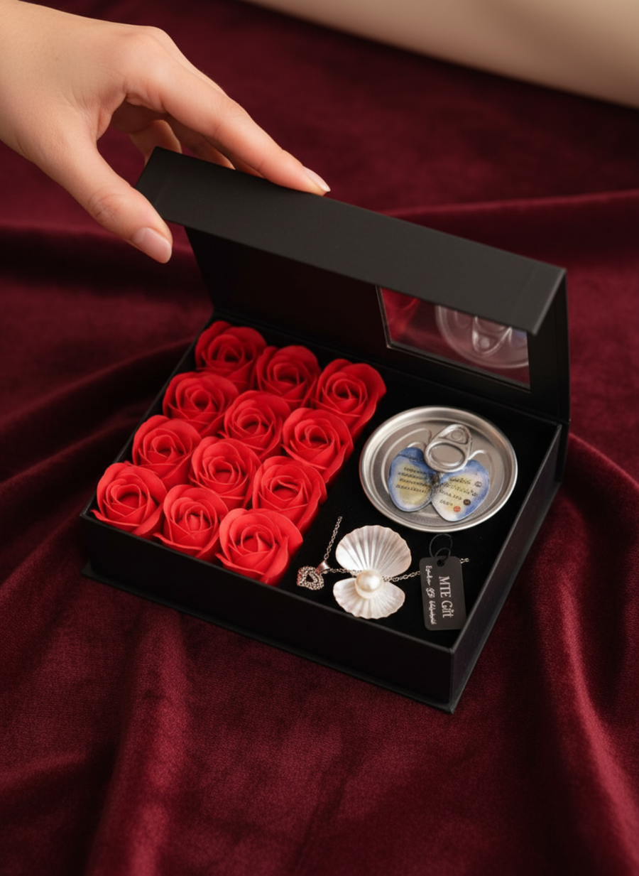 Pearl necklace with a box of roses.